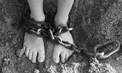 chains, feet, sand